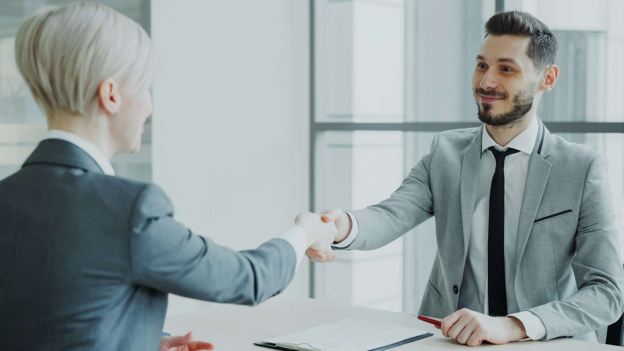 Business professionals completing a partnership discussion